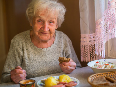 žena